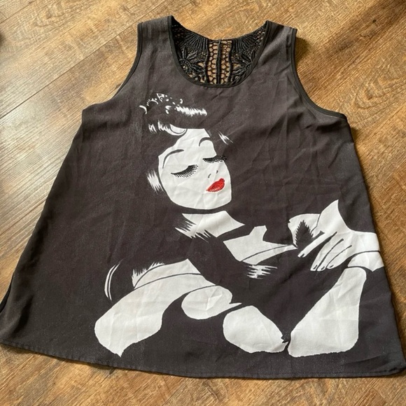 Disney Tops - Stylish Black Sleeveless Top with Graphic Design